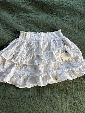White Ruffled Smocked Mini Skirt with Delicate Floral Print